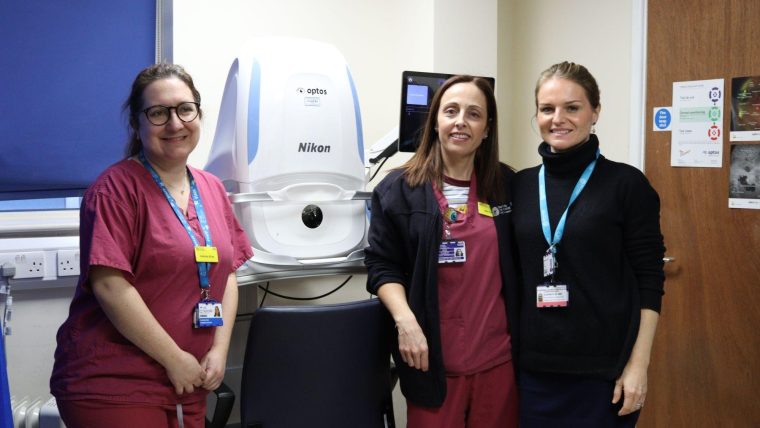 St George's staff standing next to the Optos Silverstone OCT.